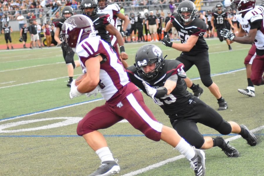 Jay Zheng ’22 evades a tackle from a Radnor linebacker. | Photos courtesy of The Enchiridion