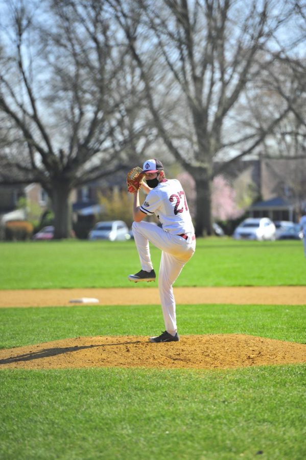 Pitcher Jacob Krimsky ’22 loads up for a pitch against Conestoga, continuing to play despite the ever-changing situation surrounding COVID-19. | Picture courtesy of The Enchiridion