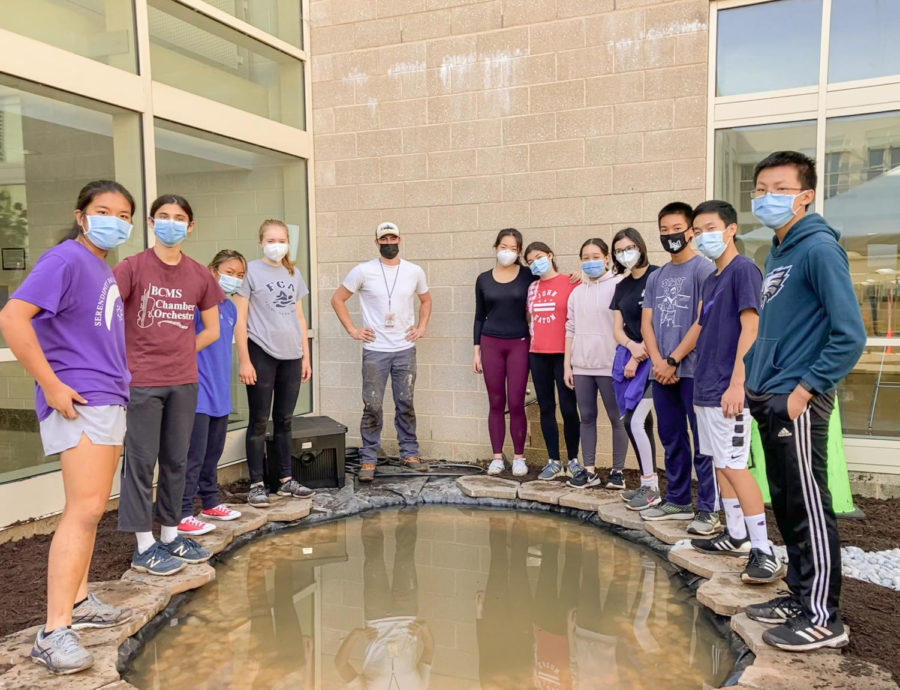 The team celebrates the progress made so far on the koi pond. | Photo courtesy of Amy Huang '23